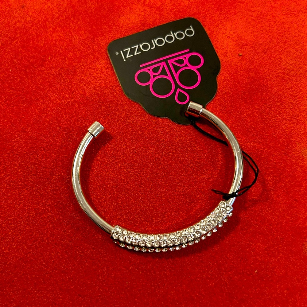 Paparazzi silver cuff bracelet with rhinestones. Perfect for the holidays!
